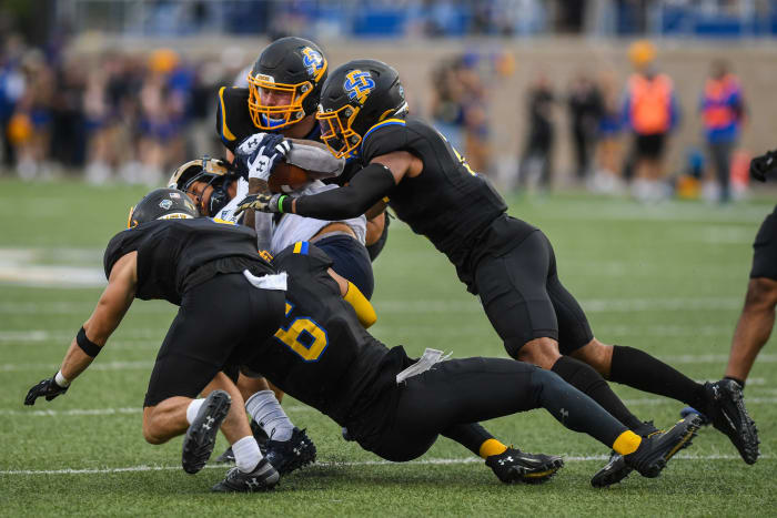 South Dakota State football players try to tackle a Montana State player at Dana J. Dykhouse Stadium in Brookings, South Dakota on Saturday, Sept. 9, 2023.